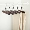 imageAmazon Basics Sturdy Wooden Pants Hangers  Natural 10PackCherry