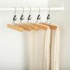 imageAmazon Basics Sturdy Wooden Pants Hangers  Natural 10PackNatural