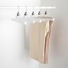 imageAmazon Basics Sturdy Wooden Pants Hangers  Natural 10PackWhite