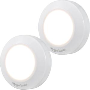 imageAmazon Basics LED Puck Lights Color Changing Battery Operated IR Remote 40 Lumens 2 Pack Wireless Stick on Lights Under Cabinet Lighting Ideal for Closets and More WhitePuck Light