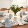 imageAmazon Basics 16Piece Porcelain Kitchen Dinnerware Set with Plates Bowls and Mugs Service for 4  White