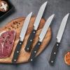 imageAmazon Basics 8Piece Kitchen Steak Knife Set 45quot Black