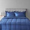 imageAmazon Basics FullQueen Comforter Set with Sheets 7Piece Navy with Grey Plaid Bedding Lightweight Microfiber BedinaBagBlue Calvin Striped
