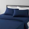 imageAmazon Basics Lightweight Super Soft WrinkleFree Easy Care Microfiber 4Piece Bed Sheet Set with 14Inch Deep Pockets Full Bright White SolidNavy Blue