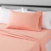 imageAmazon Basics Lightweight Super Soft WrinkleFree Easy Care Microfiber 4Piece Bed Sheet Set with 14Inch Deep Pockets Full Bright White SolidPeachy Coral