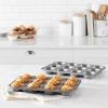 imageAmazon Basics Nonstick Round Muffin Baking Pan 12 Cups Set of 2 Gray 139x1055x122quot139x1055x122