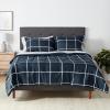 imageAmazon Basics Lightweight Microfiber Comforter Sets 7 Pieces Navy Geometrics FullQueenNavy With Grey Plaid