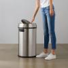 imageAmazon Basics Round Stainless Steel Trash Can with Swing lid  65 litre 172 Gallon Silver Black