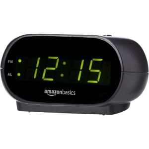 imageAmazon Basics Small Digital Oval Alarm Clock With LED Display Nightlight ampamp Battery Backup Black 45 x 35 x 24 InchesSmall