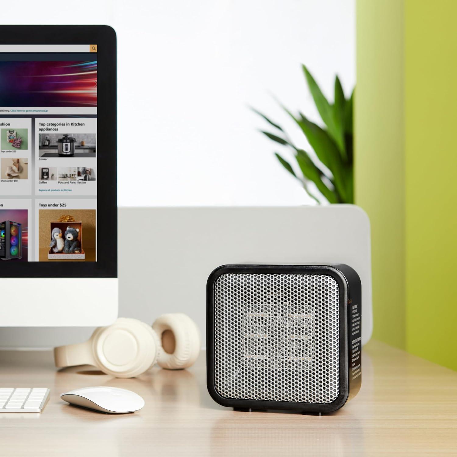 imageAmazon Basics Ceramic Space Heater Mini Heater for Office Desk Portable Tent Heater Indoor Use 500 W With TipOver Protection Lightweight 14 LBS Black 587D x 315W x 595HBlack